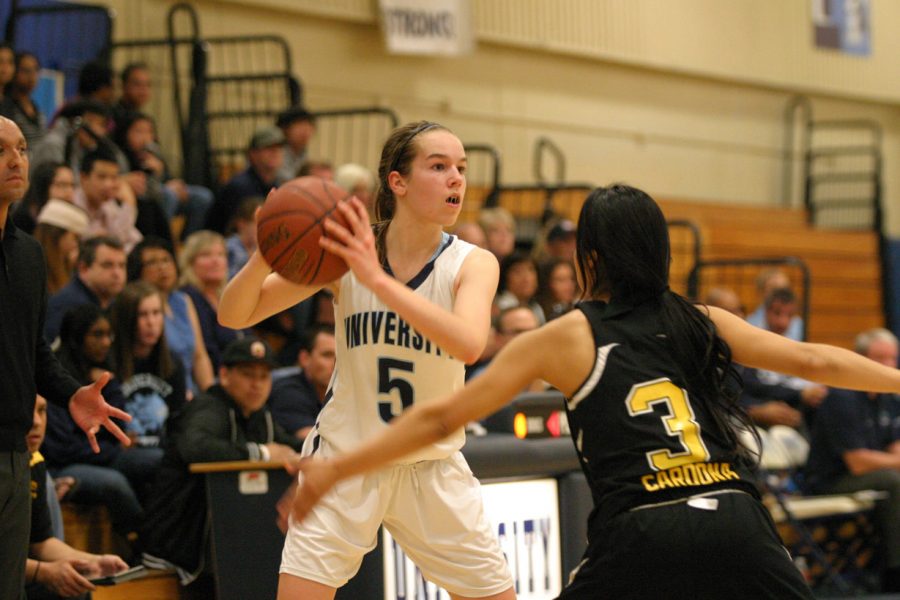 Allison Piper (So.) keeps the ball away from Santa Fe High School.