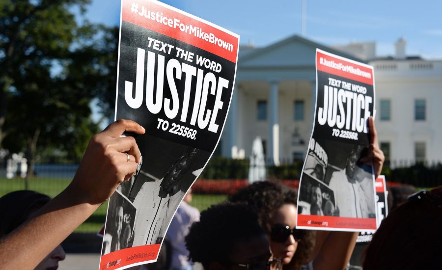Weeks after the Michael Brown shooting, activists gather at the White House to call on the Department of Justice to investigate the police officers involved in the fatal shooting (Olivier Douliery/Abaca Press/MCT).