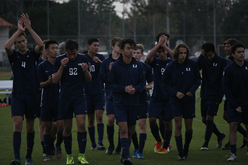 Boys Varsity Soccer team gives a round of aplause for their opponents and fans. (J.Nagy)