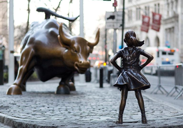 This+statue+of+Fearless+Girl+on+Wall+Street+stands+as+a+symbol+of+feminism+and+female+empowerment.+Source%3A+The+New+York+Times