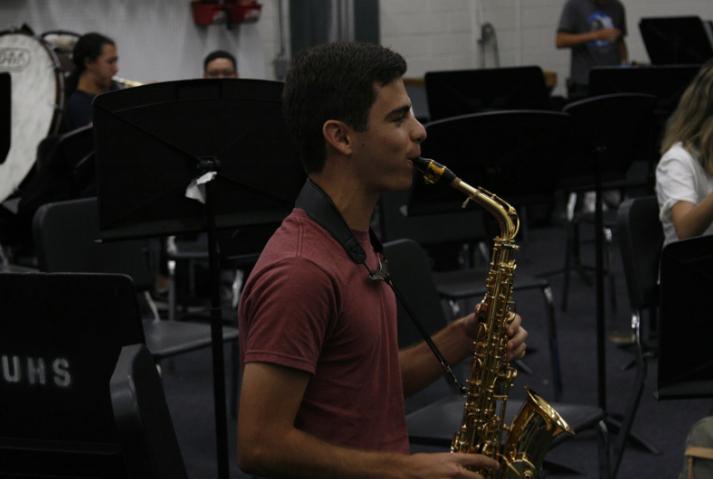 Junior Samuel Dishon, Artist of the Month, plays the saxophone.