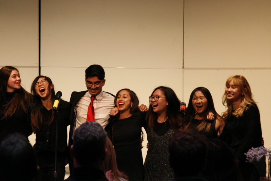 The 2018-2019 choir board enthusiastically performs the final song of the night (Kortney Maeda)