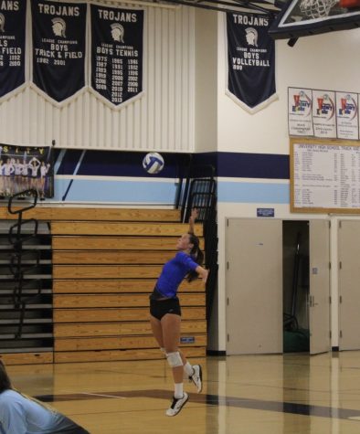 Senior Varsity Player Katrina Soto, jumps serves the ball into the court against Crean Lutheran at home game at University High School.
