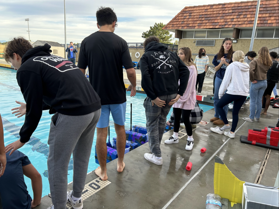 UHS Marine Science students attempt to walk across the UHS pool with their shoe design during the class periods of Jan. 12-13. The competition stimulated students knowledge in physics through a hands-on project.