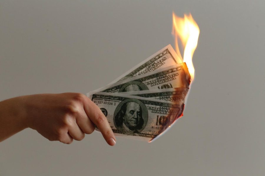 Graphic of burning American money. 