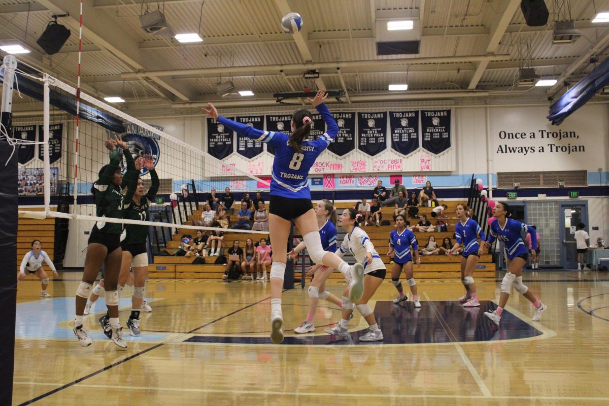 During a home pink out volleyball game against the Irvine Vaqueros, UHS Varsity player Pearl Stapp spikes the ball onto the opposing teams side of the court, resulting in a kill.