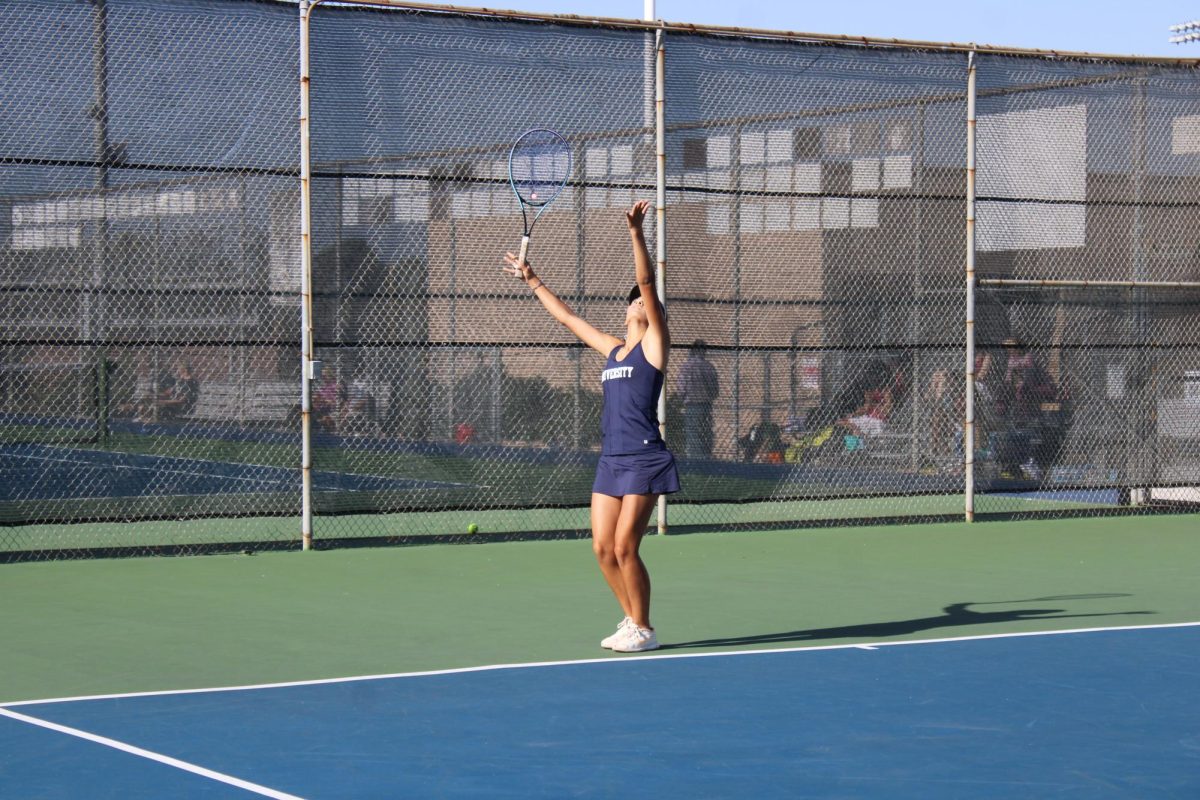Ava Bocek, a varsity senior athlete on UHS Girls Tennis. While playing doubles, she served as her teammate was up against the net, waiting for the ball. 
