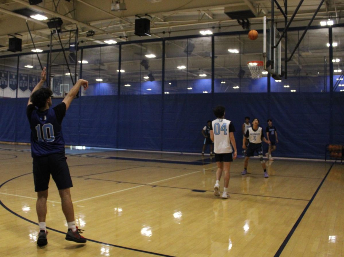 Senior Ali Zadeh practices as part of the UHS Varsity Boys Basketball team for their upcoming games this season.