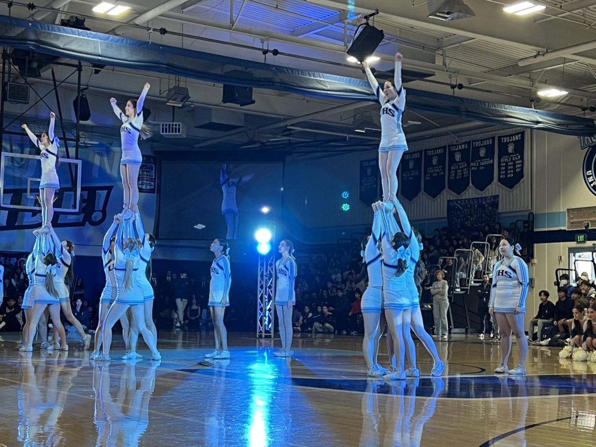 UHS Pep Squad performs a routine during the Winter Sports Pep Rally.