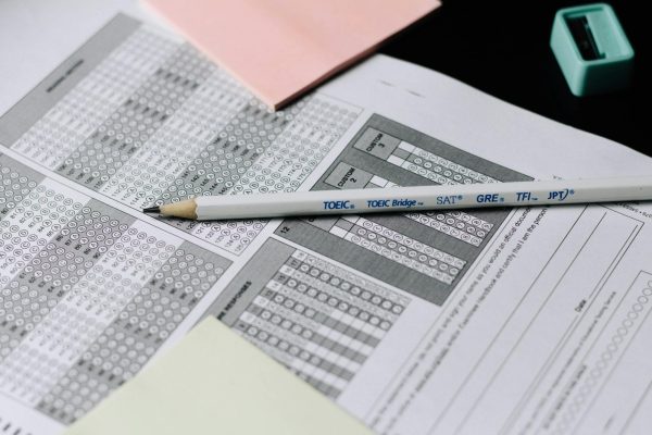 Standardized test answer sheet with a pencil that indicates the testing methods.