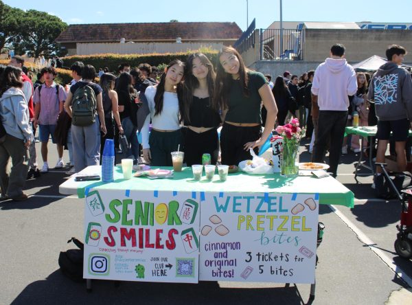 Members of a club called Senior Smiles selling Wetzel Pretzel bites to raise money. At University High School’s Clubapalooza, clubs set up tables together, selling food or other items to raise money for their club. 
