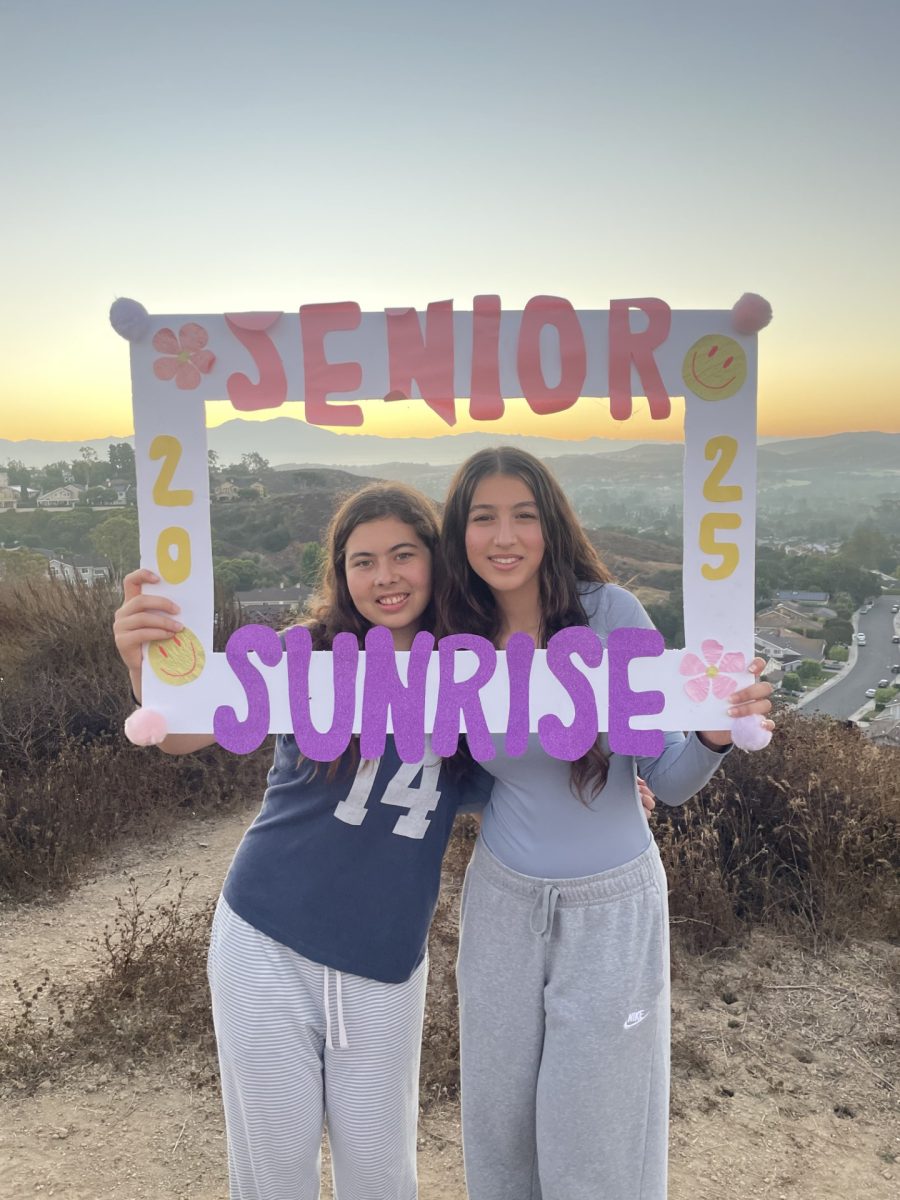 UHS Seniors Emily Butler and Shadee Ghiassi pose for pictures at Senior Sunrise.