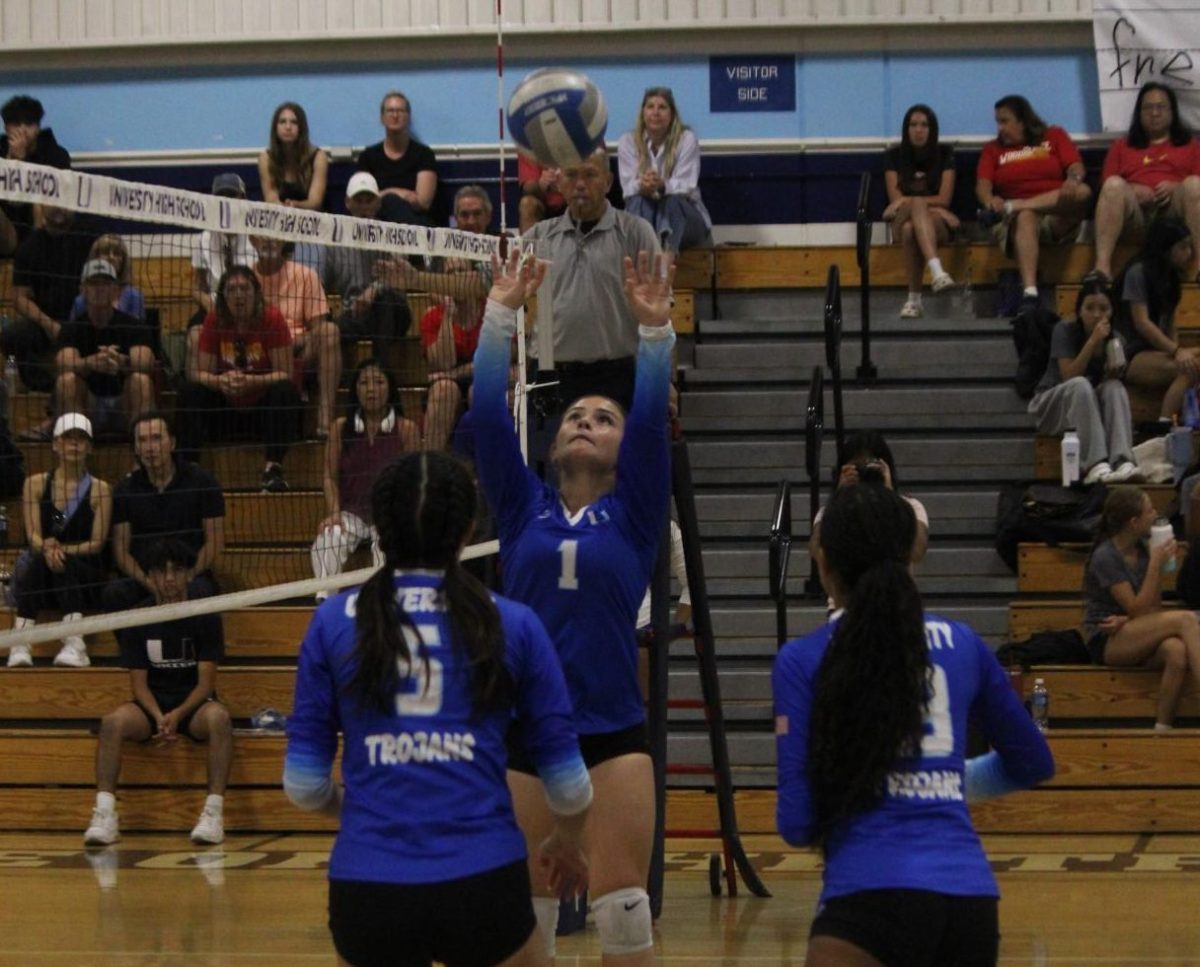 UHS Girls' Volleyball setter initiates a point scoring opportunity for her team.