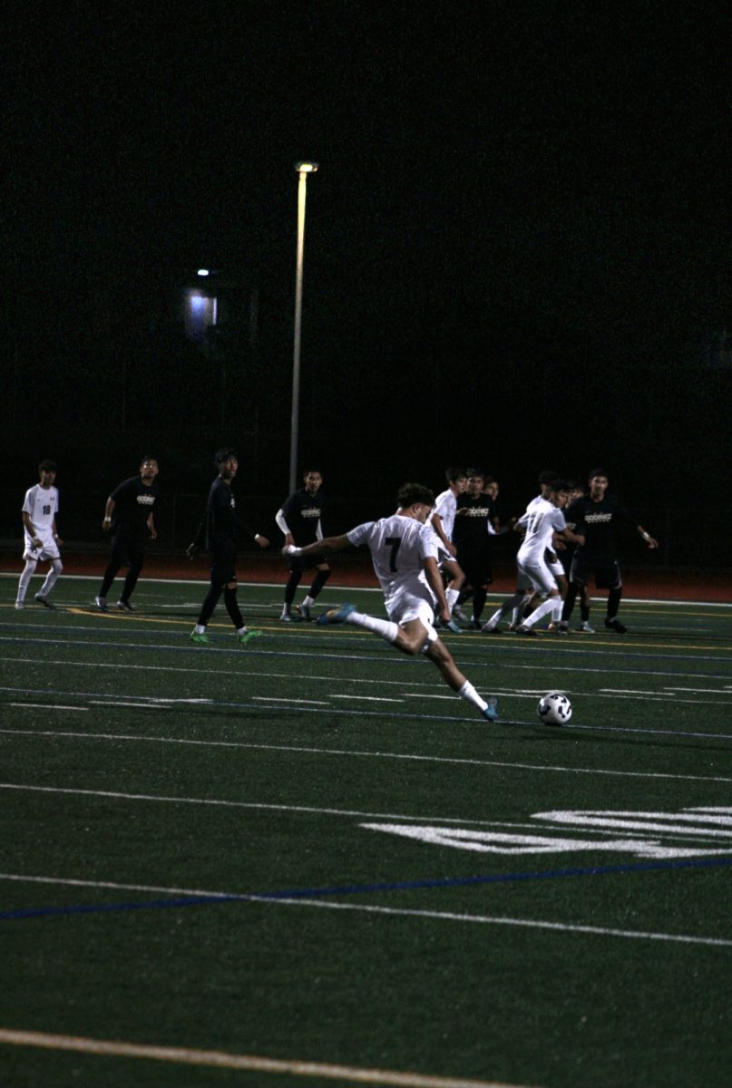 Lead striker, Mounir Albakri, attempts a very accurate long-range shot.