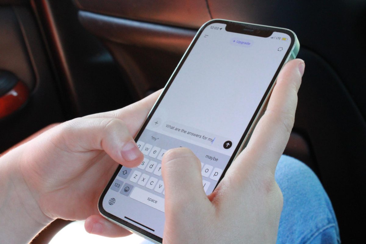 UHS student uses Google Gemini to search up answers on their iPhone. AI chatbots, such as ChatGPT and Gemini, have become popular sources of homework help.