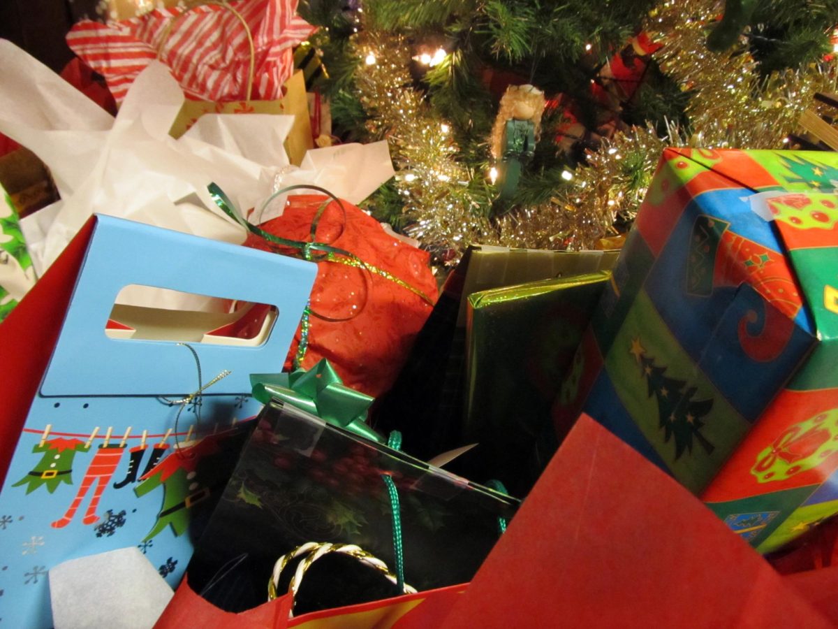 Brightly wrapped presents sit under a Christmas tree. Students mentioned wanting tech products, candy and cash for the holidays. 