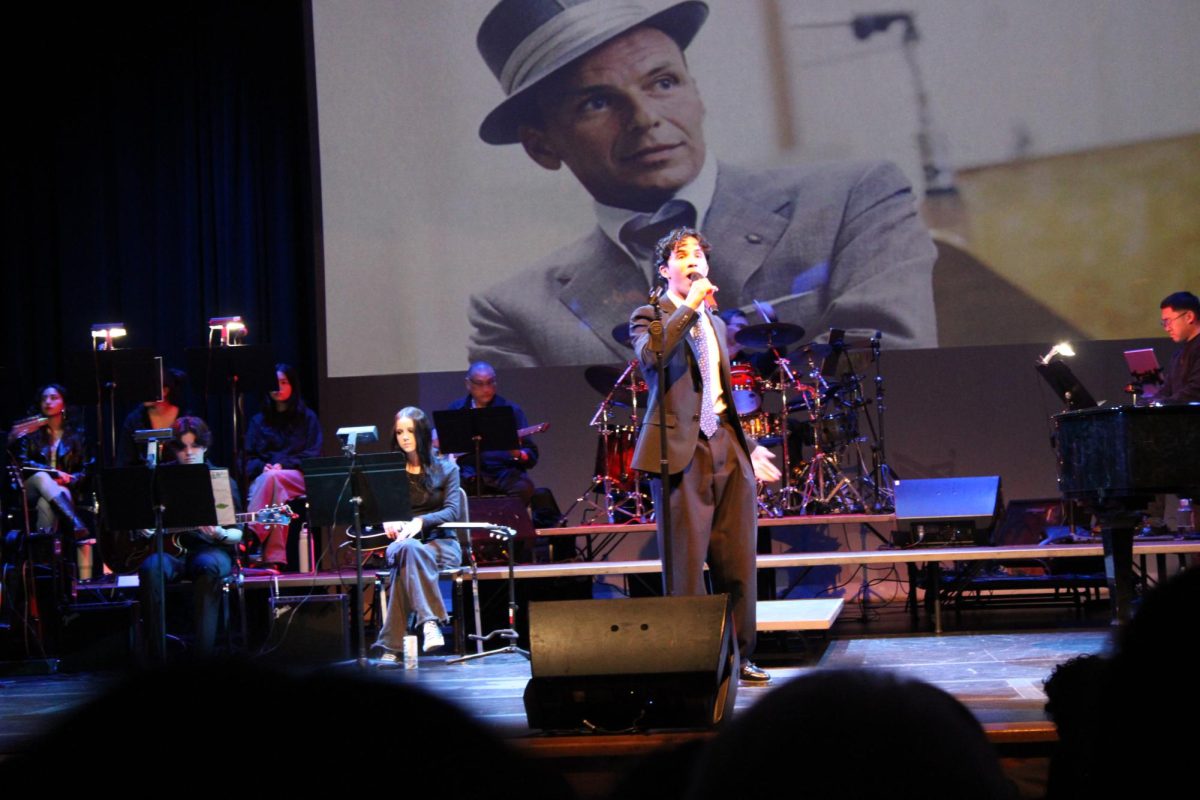 Senior Isaac Sarkar performs "New York" by Frank Sinatra in the "Legends Concert." 
