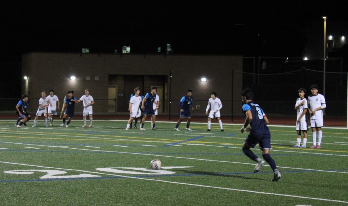 Senior UHS Boys' Soccer captain Kasra Ghoddousi lines up for a free kick during Senior Night against the Laguna Beach Breakers.