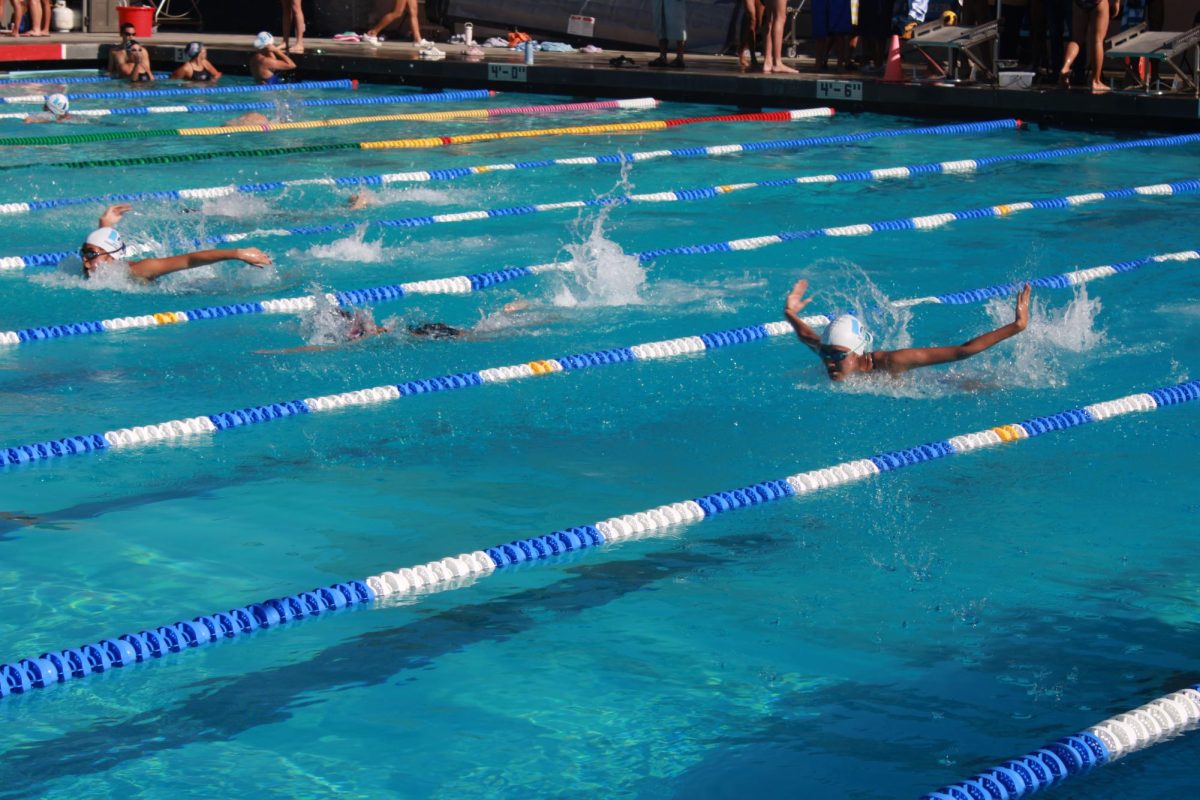 UHS Swim in action during their meet against Portola on March 11.